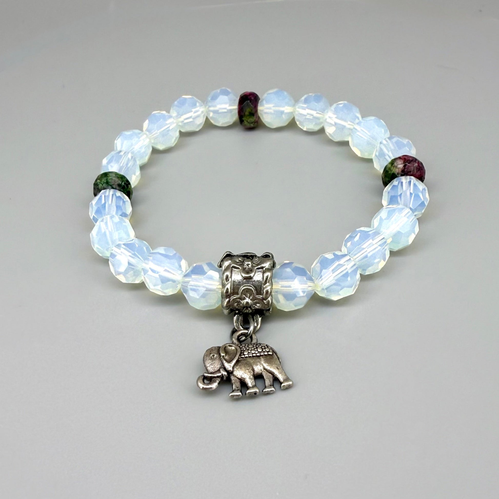 Opal and rhodochrosite beaded bracelet, 17cm, light crystal-blue and soft pink gemstone beads on elastic stretch band.