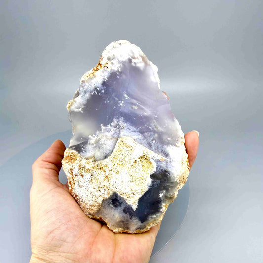 Untreated grey-blue chalcedony rough (quartz) stone with cloudy milky texture