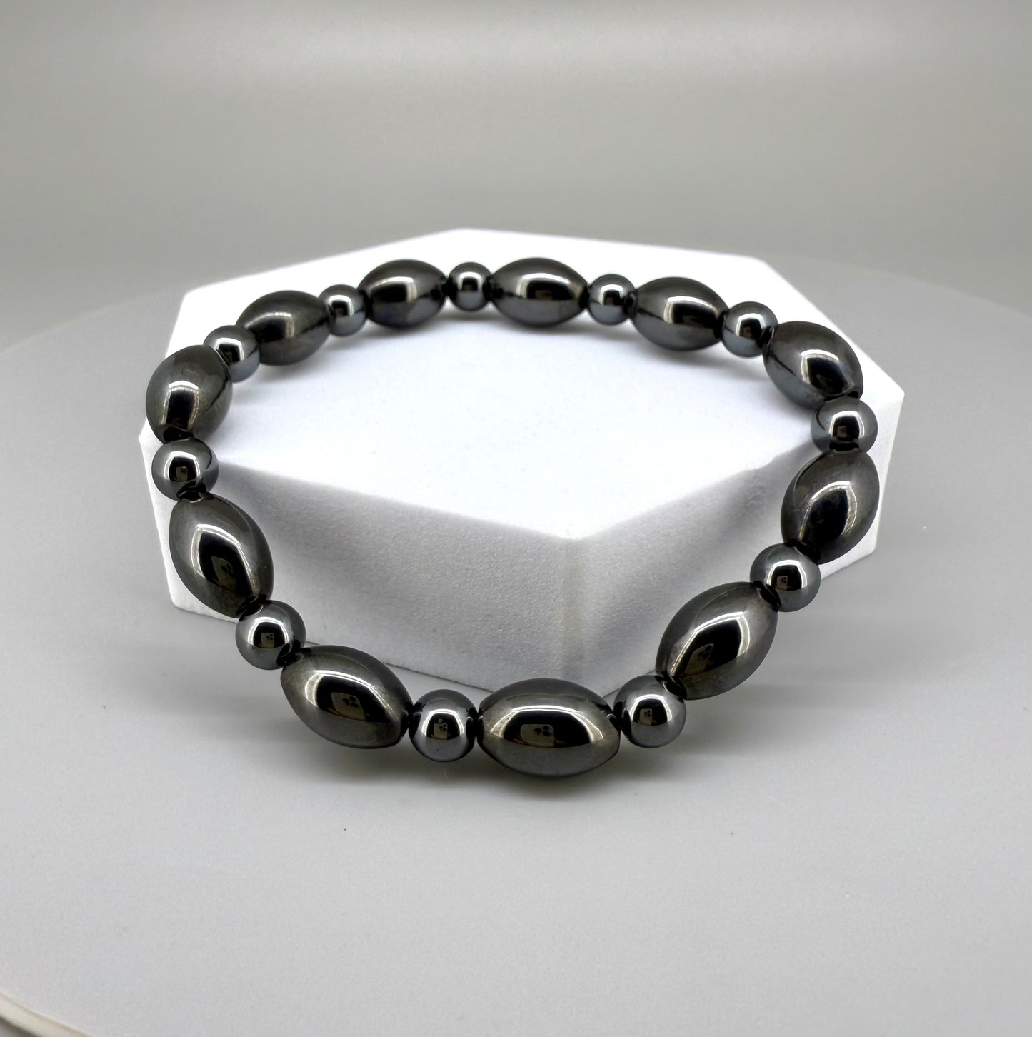 Hematite beaded bracelet, 19cm, dark metallic grey magnetic gemstone beads on elastic stretch band.
