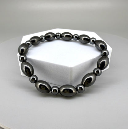 Hematite beaded bracelet, 19cm, dark metallic grey magnetic gemstone beads on elastic stretch band.