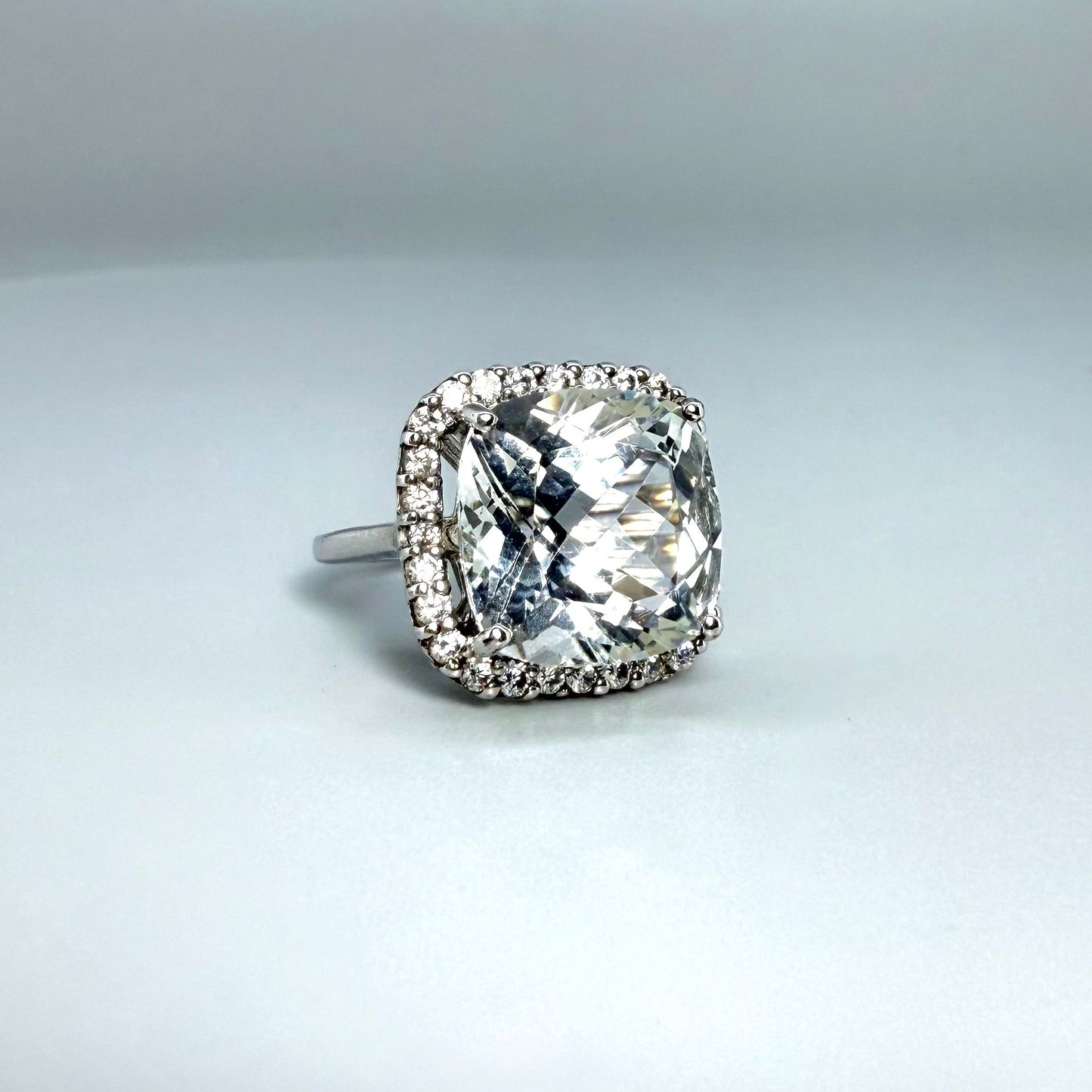 White gold plated silver ring with topaz