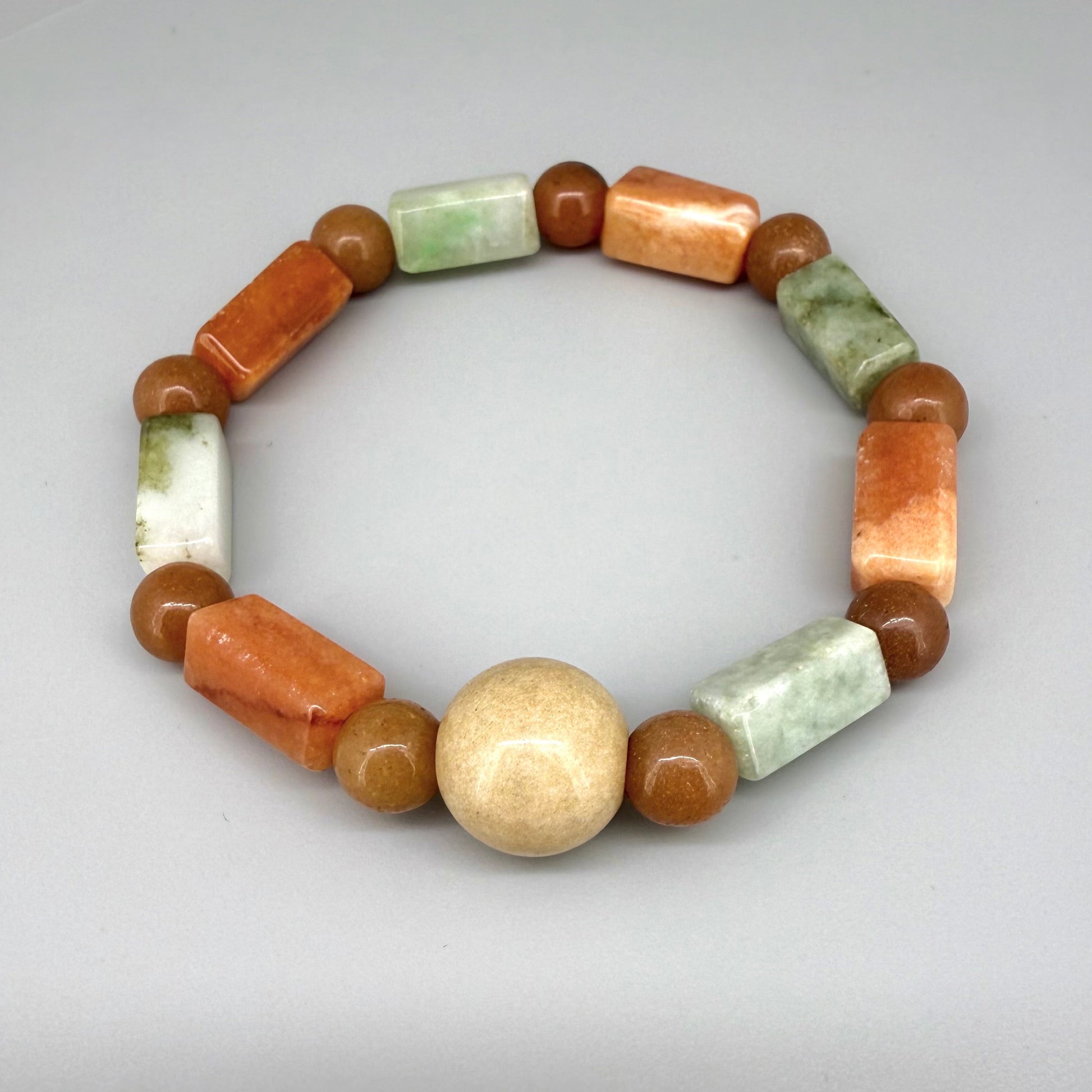 Jade beaded bracelet, 19cm, cream, orange, and brown baguette-style gemstone beads with round spacers on elastic stretch band.