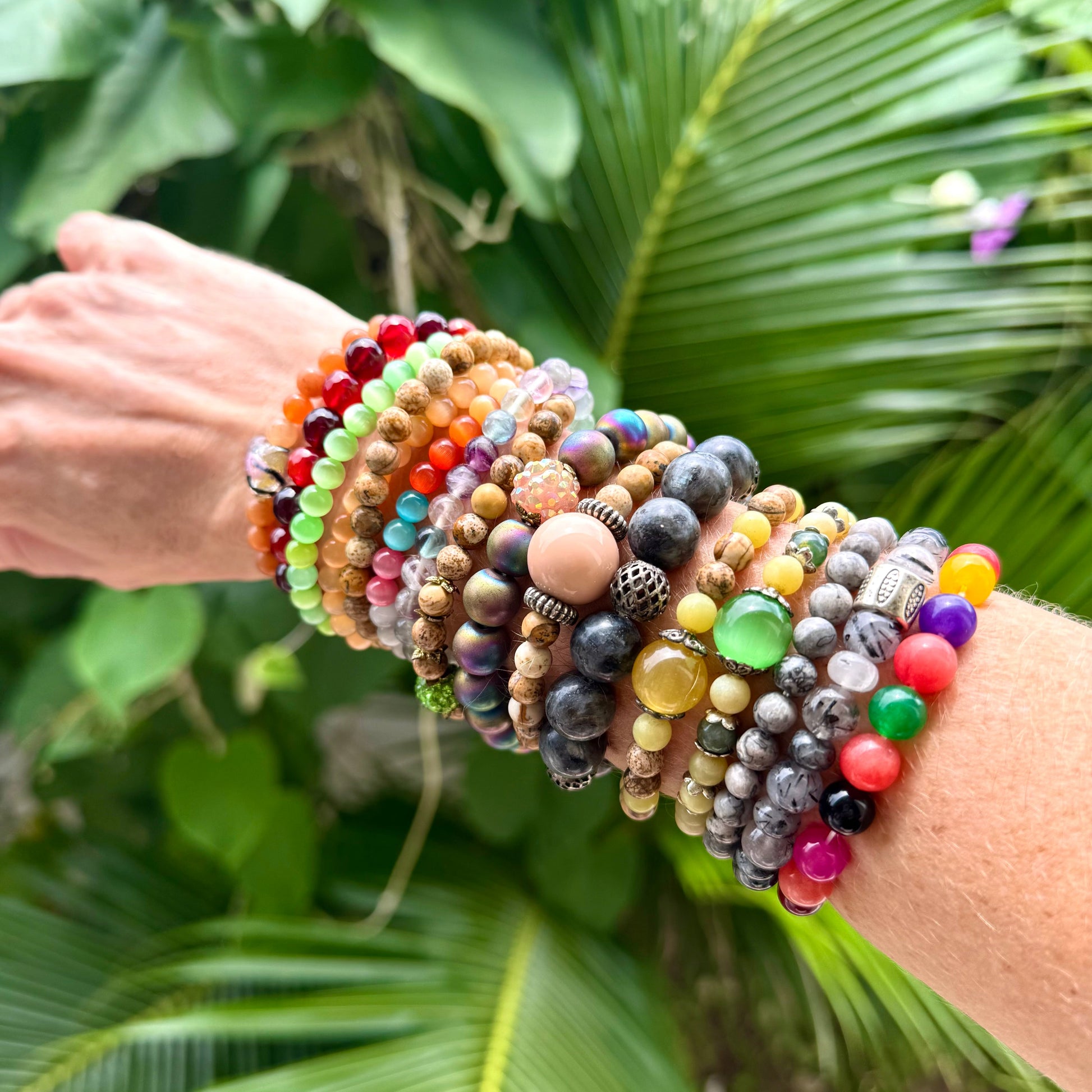 Multiple beaded bracelets made of natural gemstones