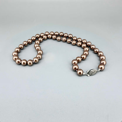 Rose-gold imitation pearl necklace, 45 cm / 17.7 in, featuring round polished beads with a refined luster.