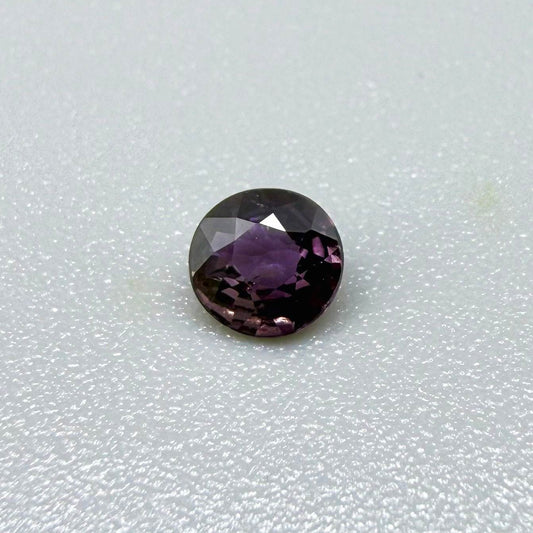 0.33 ct natural purple sapphire from Bo Rai, round cut.