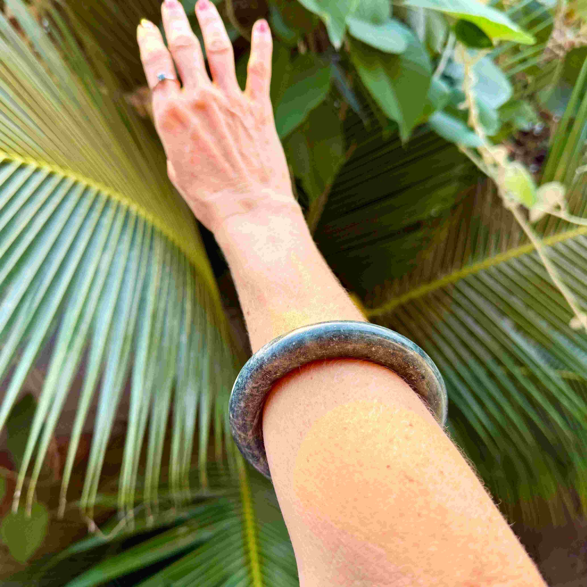 Polished green-blue jade bangle with smooth surface and natural color variations, 20 cm inner circumference