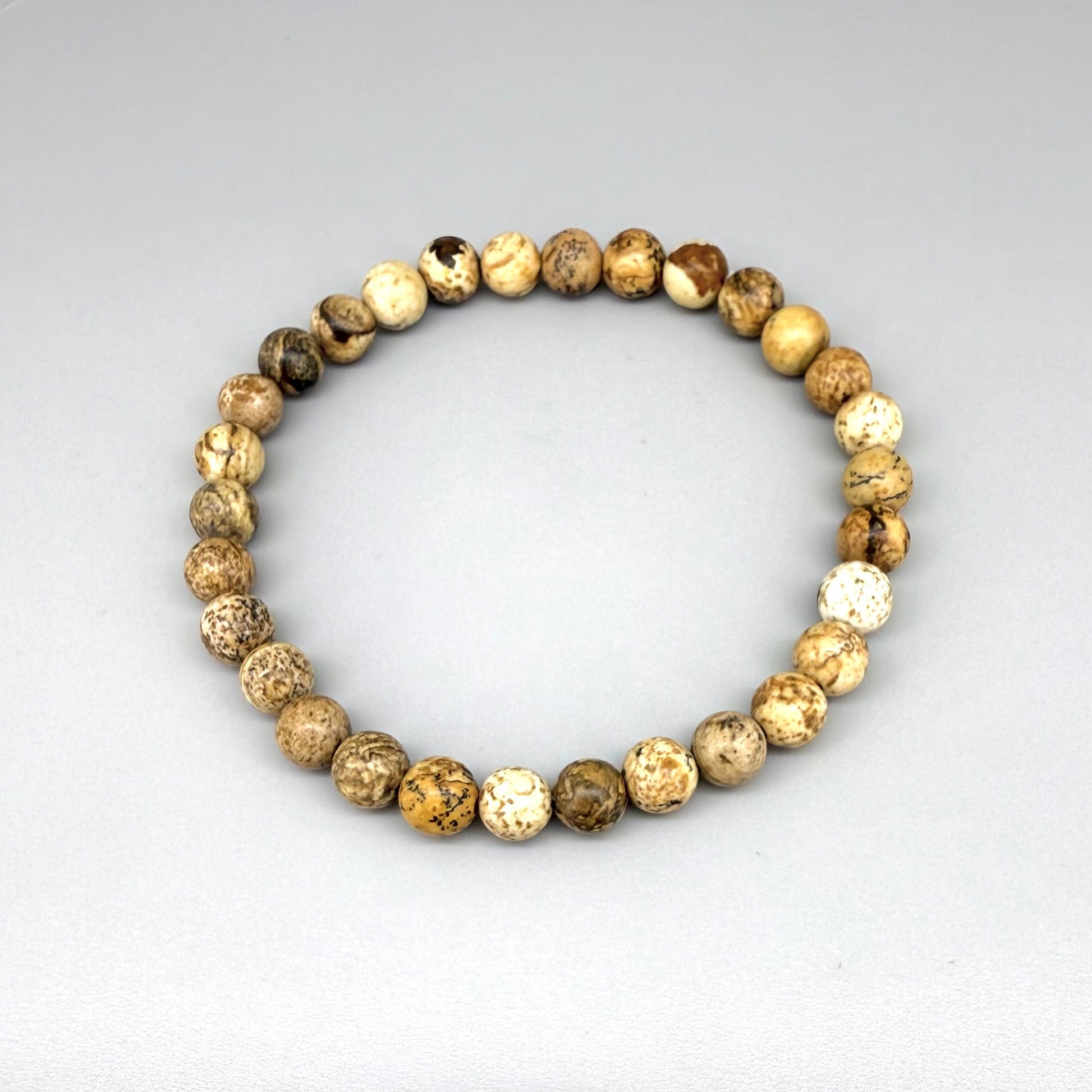 Jasper beaded bracelet, natural gemstone beads in light earthy tones on elastic stretch band.
