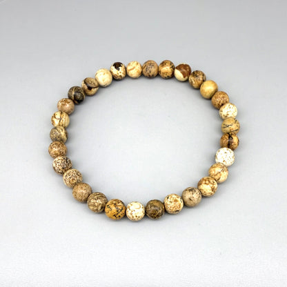 Jasper beaded bracelet, natural gemstone beads in light earthy tones on elastic stretch band.