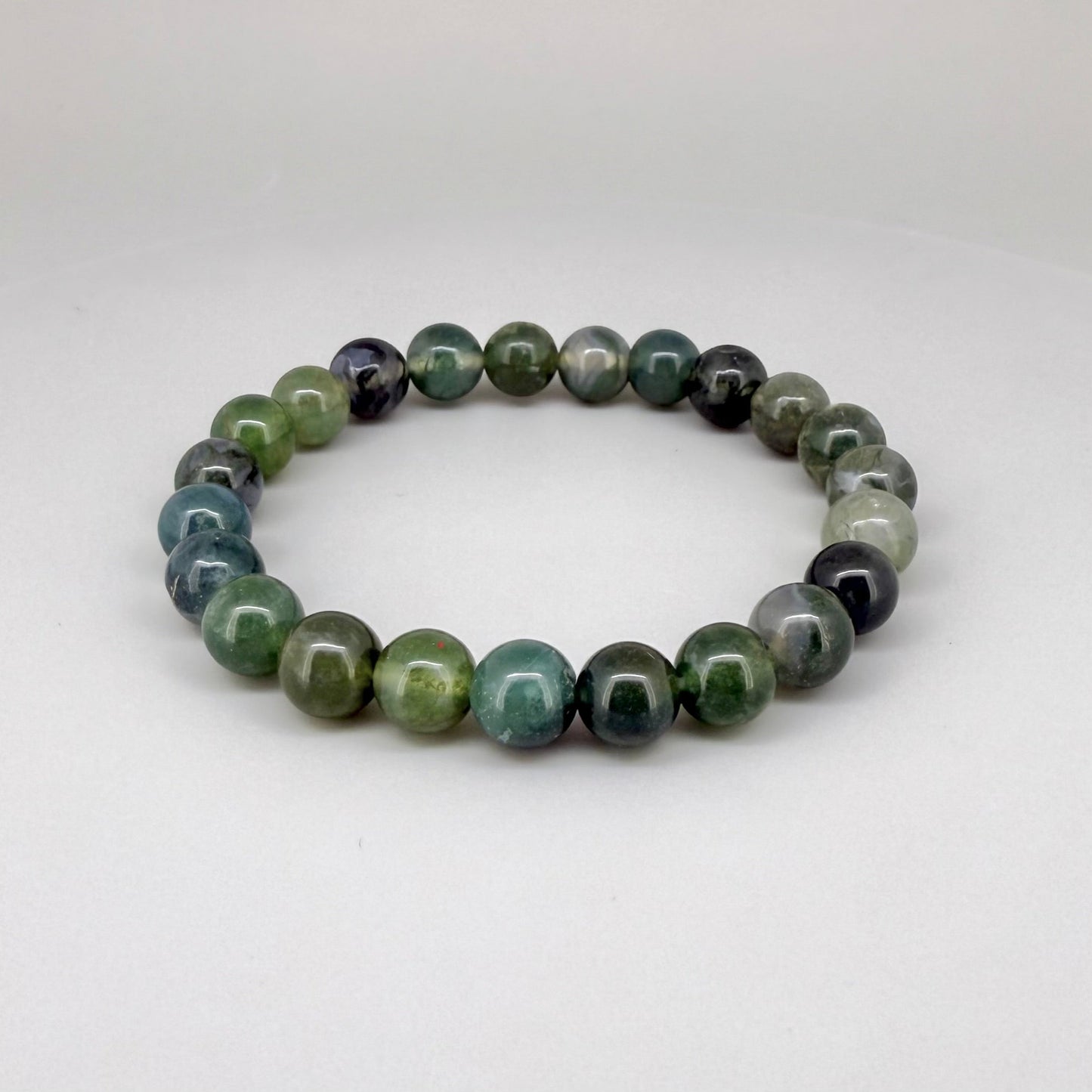 Moss agate beaded bracelet, 18cm, natural green and white gemstone beads with moss-like patterns on elastic stretch band.