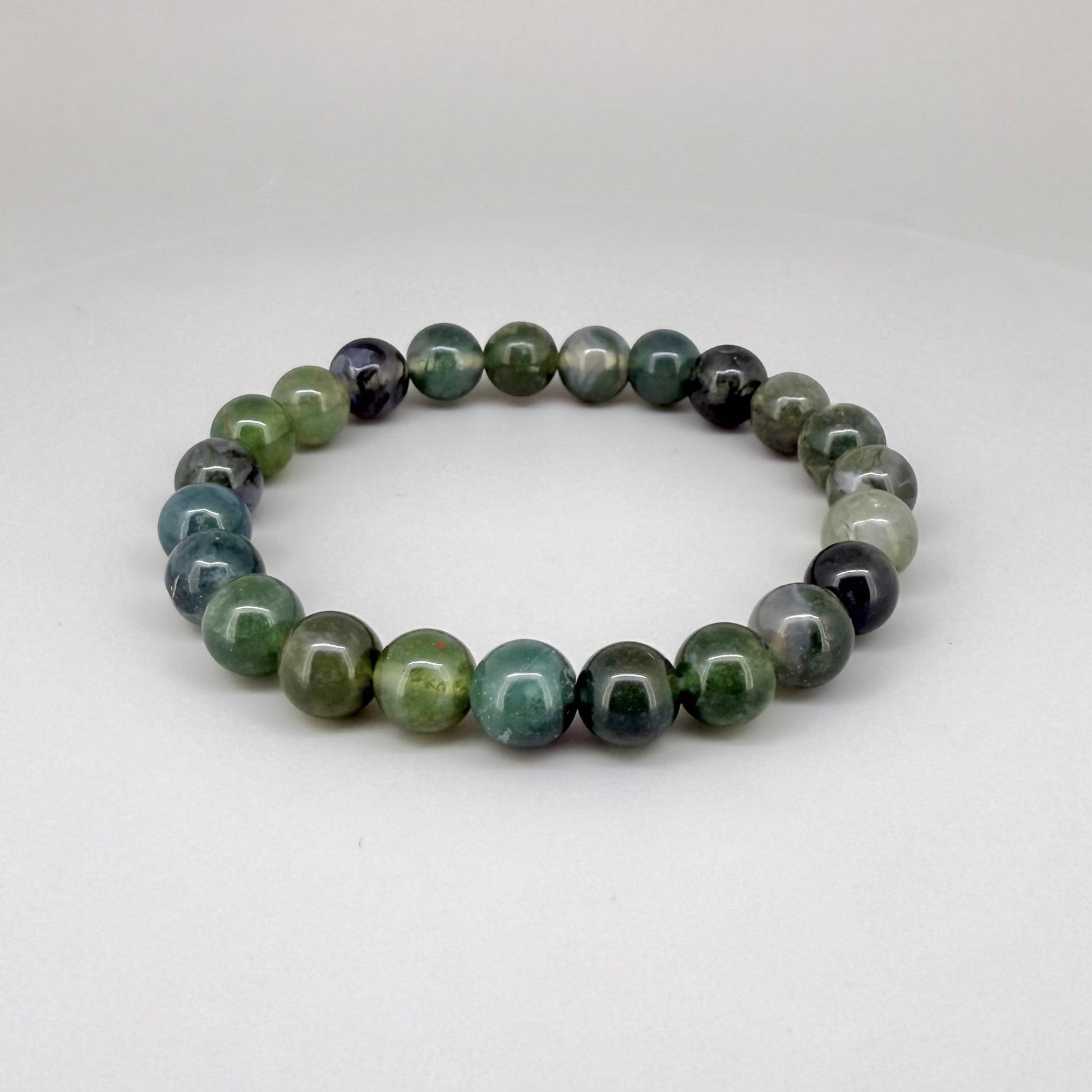 Moss agate beaded bracelet, 18cm, natural green and white gemstone beads with moss-like patterns on elastic stretch band.