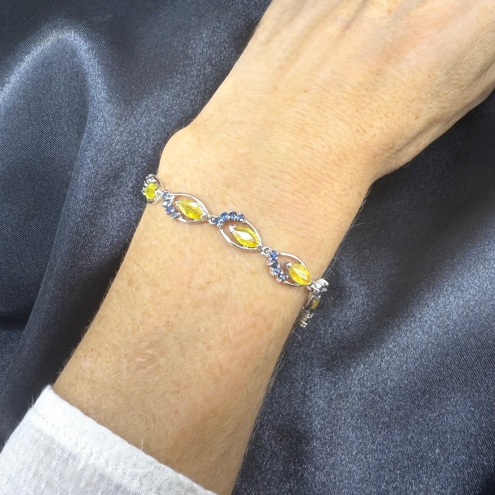 Sapphire bracelet with yellow and blue gemstones set in white gold plated silver