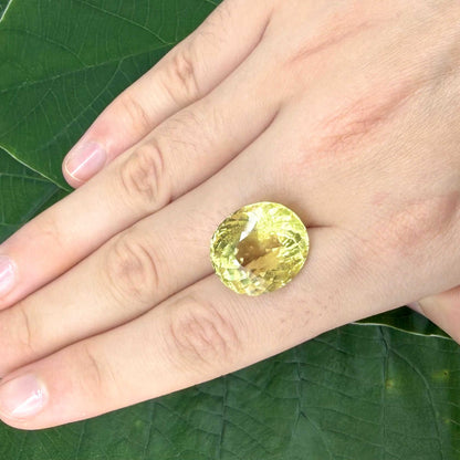 16.75 ct natural lemon quartz from Africa, oval cut with bright yellow color.