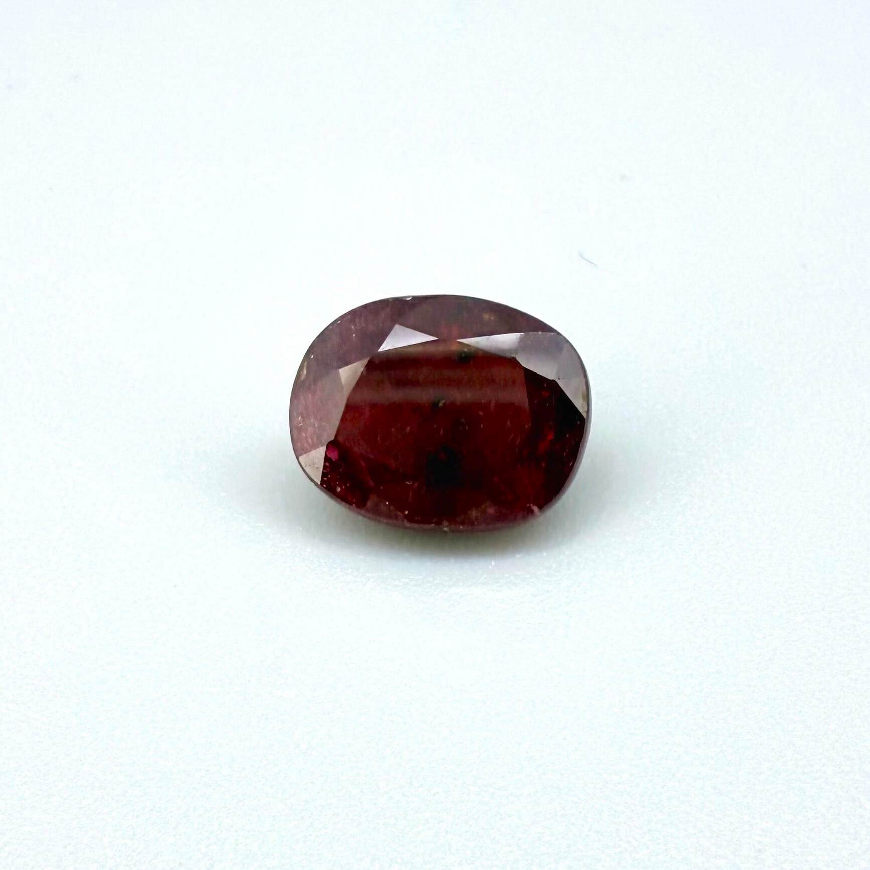 4.5 ct natural ruby from Madagascar, oval cut with vibrant red color.