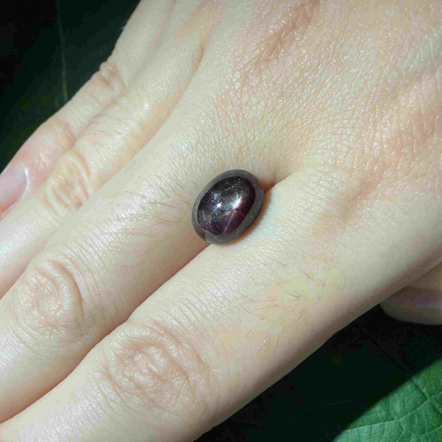 4.67 ct natural bordeaux-red Star Ruby cabochon with soft star effect and polished dome.