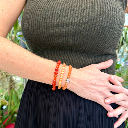 Carnelian beaded bracelet, 18cm, natural orange-red gemstone beads on elastic stretch band.