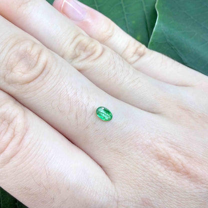 0.22 ct natural untreated Zambian emerald, oval faceted with bright bluish-green color.
