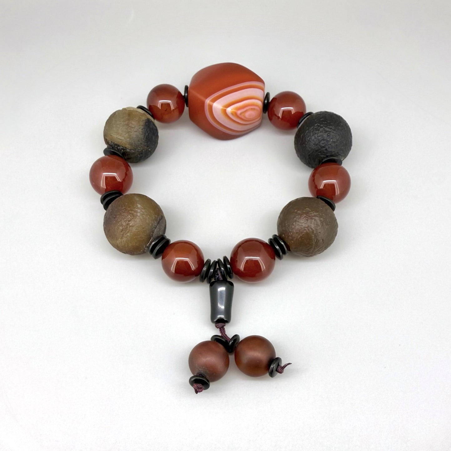 Agate and carnelian beaded bracelet, 20cm, with fiery red, brown, and colorful accent beads on elastic stretch band.
