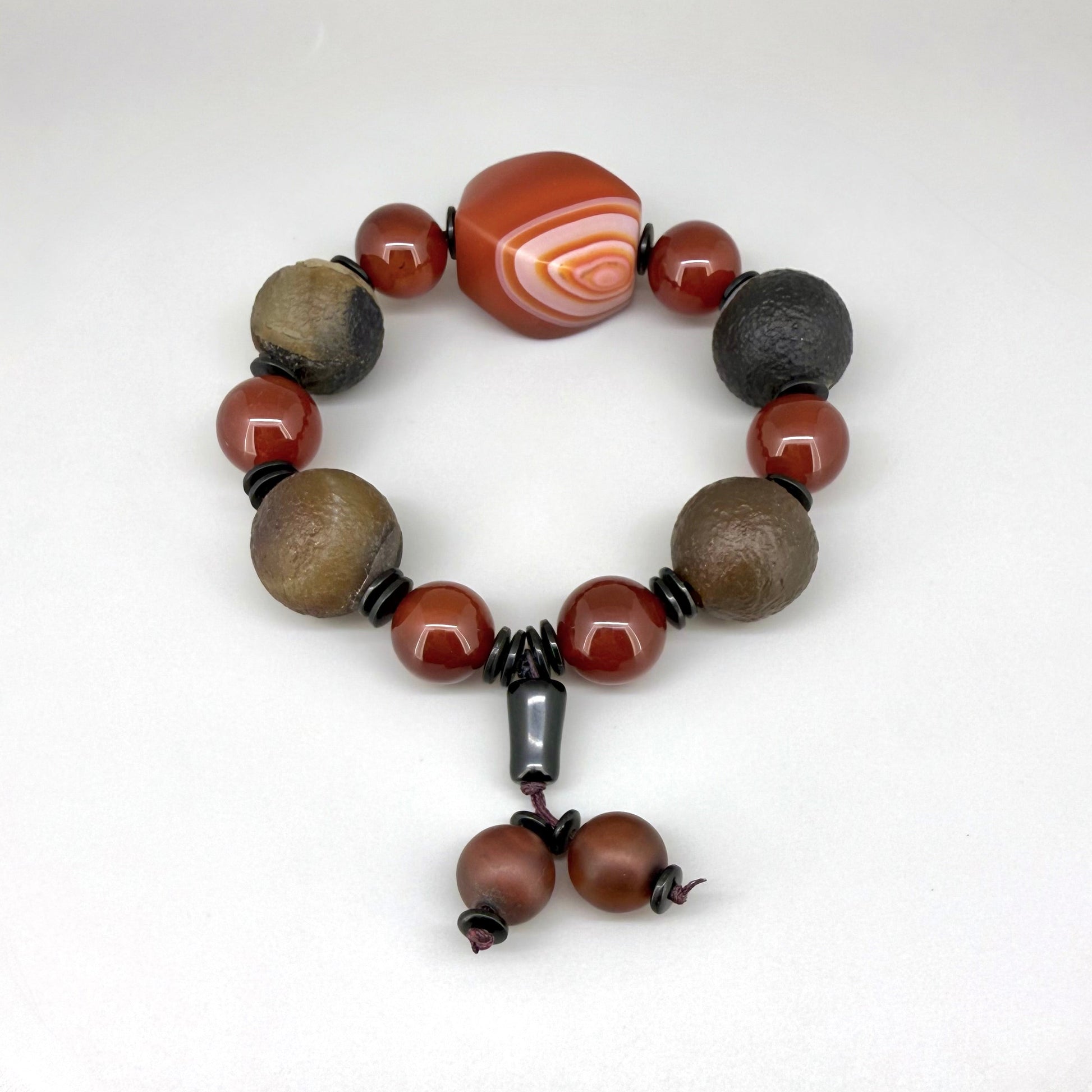 Agate and carnelian beaded bracelet, 20cm, with fiery red, brown, and colorful accent beads on elastic stretch band.