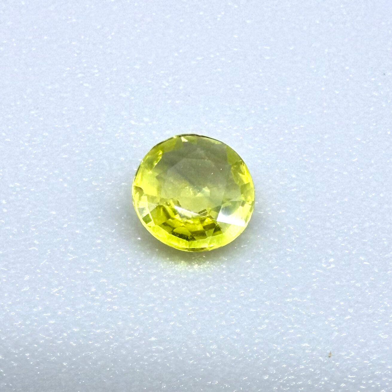 0.18 ct natural yellow sapphire from Bangkaja, round cut.