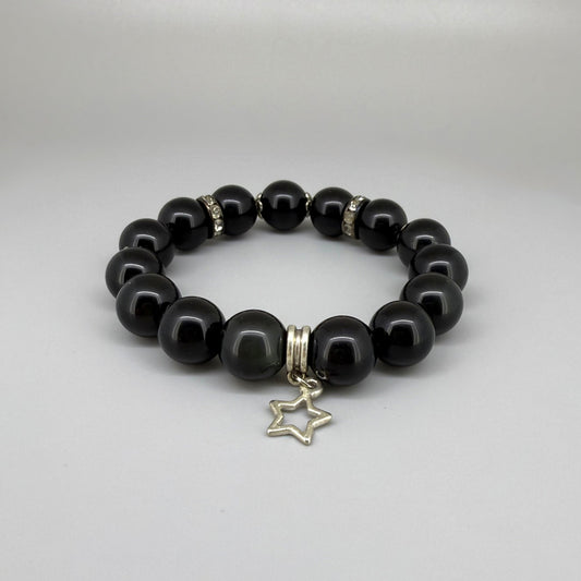 Obsidian beaded bracelet, 18cm, natural black gemstone beads with silver-toned star charm on elastic stretch band.