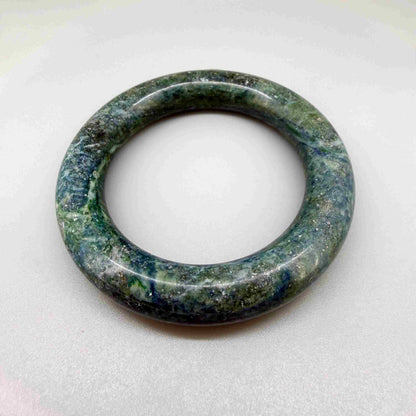 Polished green-blue jade bangle with smooth surface and natural color variations, 20 cm inner circumference