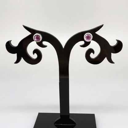 Rhodolite garnet stud earrings in white gold plated sterling silver with butterfly backs.