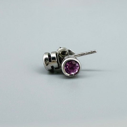 Rhodolite garnet stud earrings in white gold plated sterling silver with butterfly backs.
