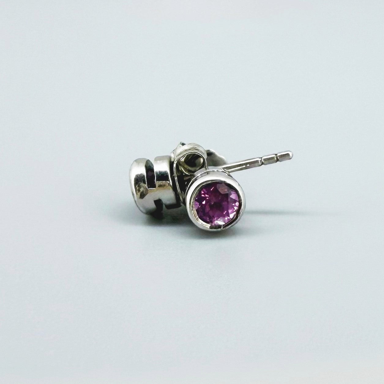 Rhodolite garnet stud earrings in white gold plated sterling silver with butterfly backs.
