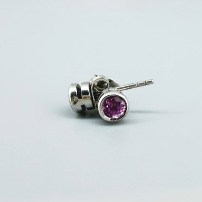 Rhodolite garnet stud earrings in white gold plated sterling silver with butterfly backs.