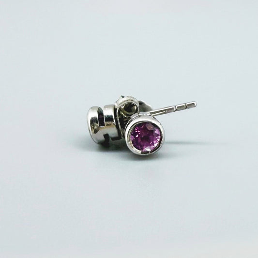 Rhodolite garnet stud earrings in white gold plated sterling silver with butterfly backs.