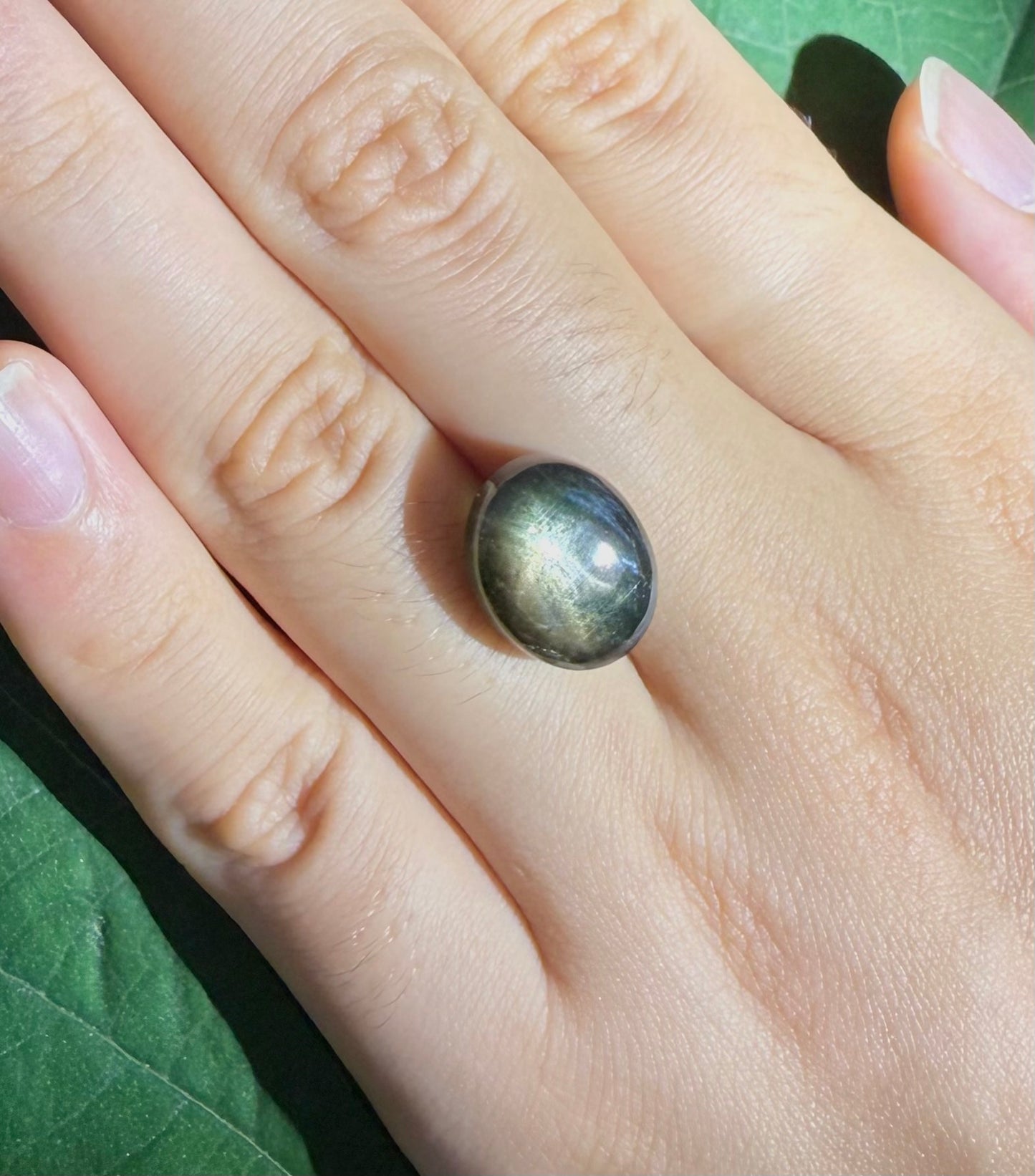 Golden-brown star sapphire cabochon, natural gemstone with subtle asterism