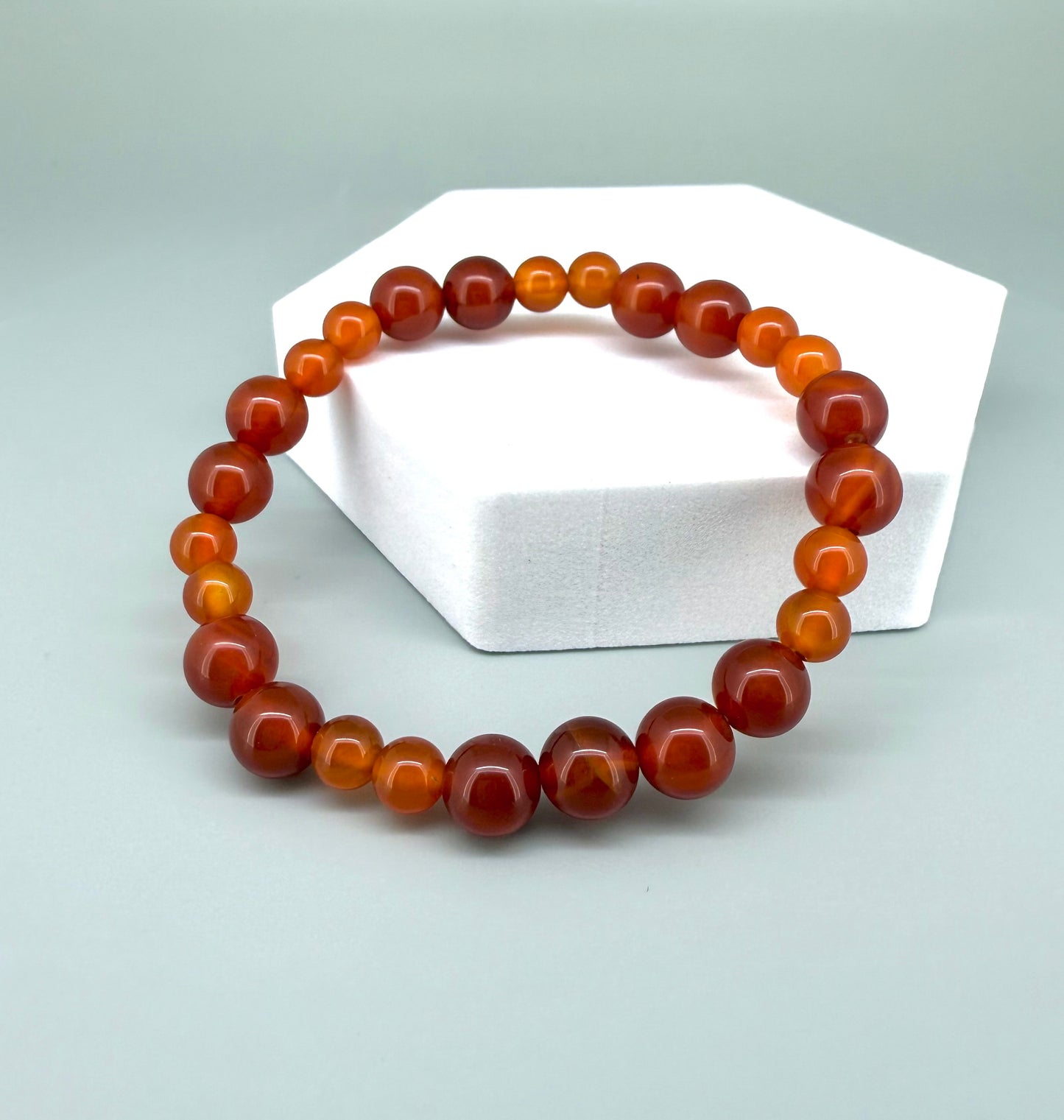 Carnelian beaded bracelet, 18cm, natural orange-red gemstone beads on elastic stretch band.
