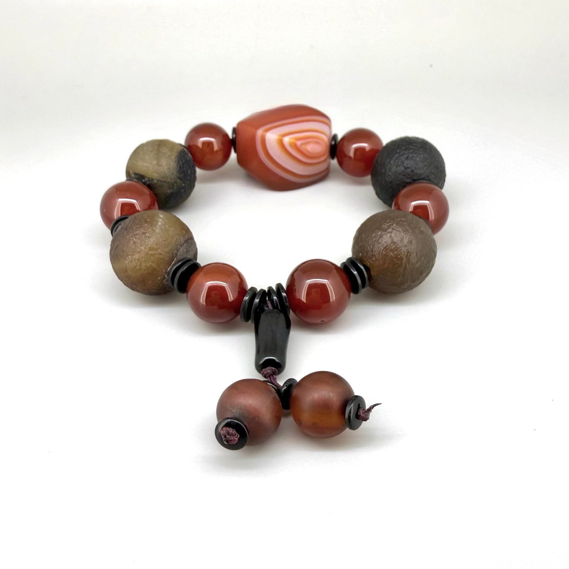 Agate and carnelian beaded bracelet, 20cm, with fiery red, brown, and colorful accent beads on elastic stretch band.