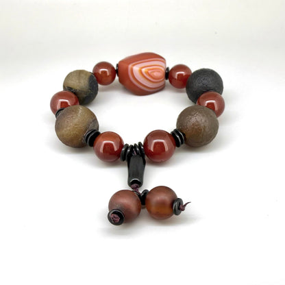 Agate and carnelian beaded bracelet, 20cm, with fiery red, brown, and colorful accent beads on elastic stretch band.