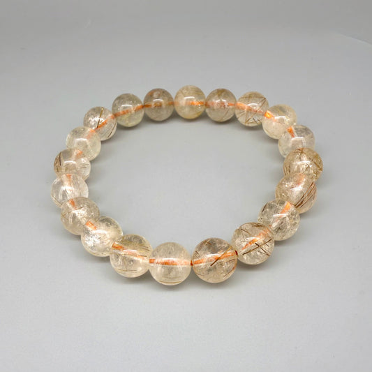 Bronze rutilated quartz beaded bracelet, natural gemstone beads with bronze rutile threads on elastic stretch band.
