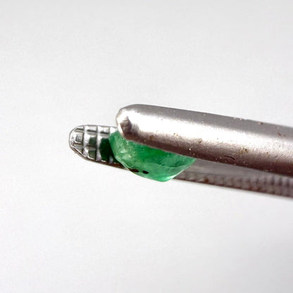 0.2 ct natural untreated Zambian emerald, oval faceted with vivid bluish-green color.