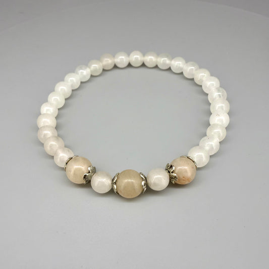 Jade beaded bracelet, 19cm, natural green gemstone beads with three slightly larger darker accent stones on elastic stretch band.