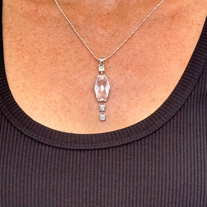 Handmade white gold plated silver pendant with 14.76 ct rose quartz and cubic zirconia accents, elegant and refined design.