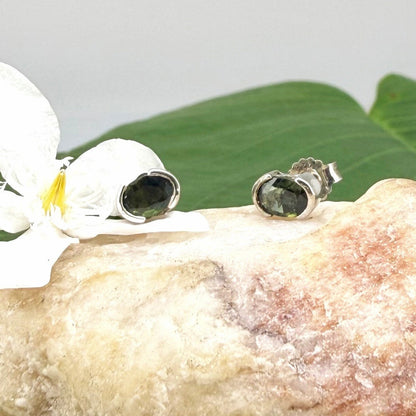 Green sapphire stud earrings in white gold plated sterling silver with butterfly backs.