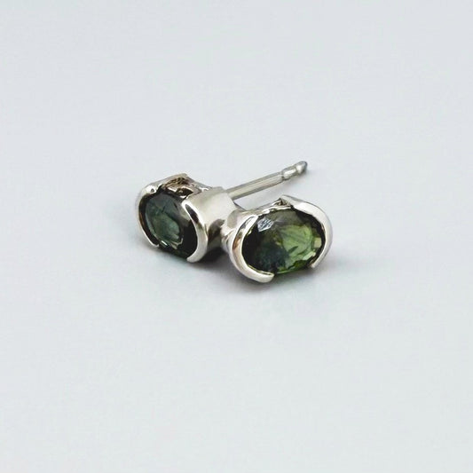 Green sapphire stud earrings in white gold plated sterling silver with butterfly backs.