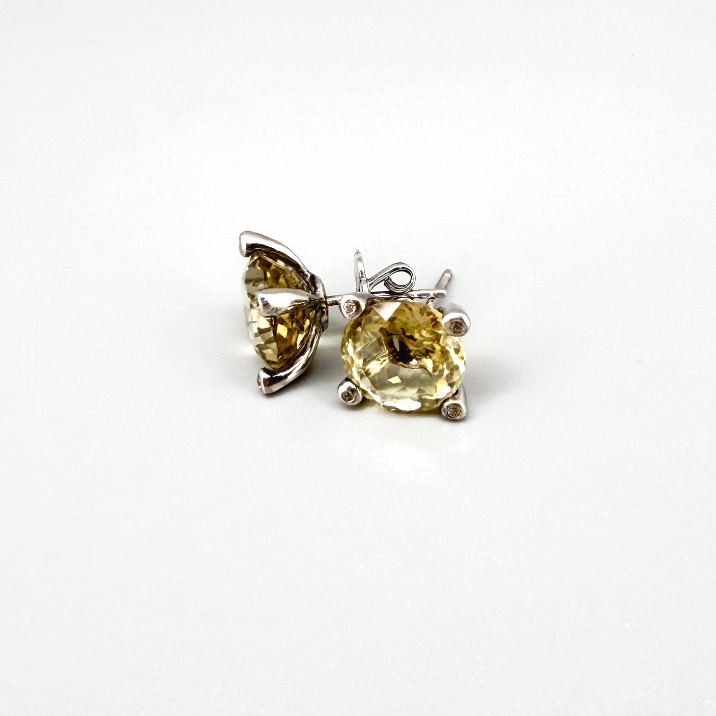 White gold plated silver stud earrings with 8.3 ct natural Lemon Quartz; golden-yellow gemstones in refined design.