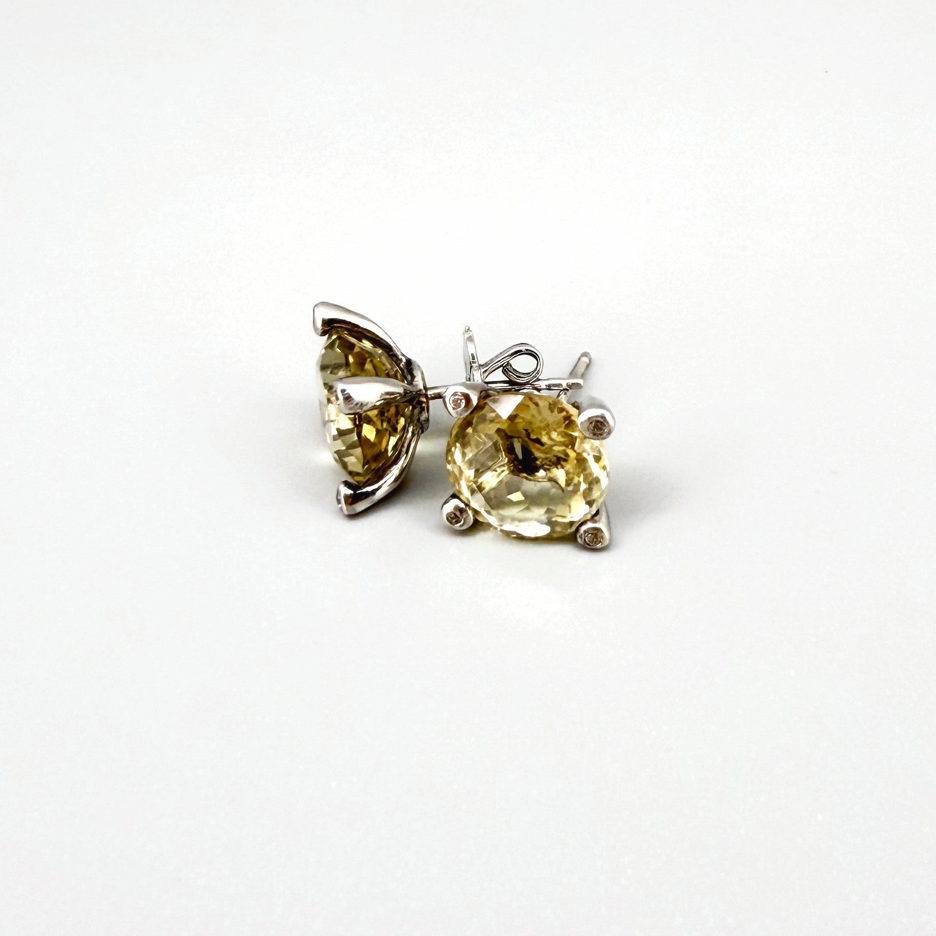 White gold plated silver stud earrings with 8.3 ct natural Lemon Quartz; golden-yellow gemstones in refined design.
