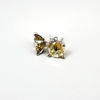 White gold plated silver stud earrings with 8.3 ct natural Lemon Quartz; golden-yellow gemstones in refined design.