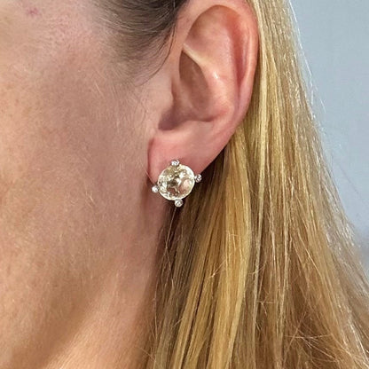 White gold plated silver stud earrings with 8.3 ct natural Lemon Quartz; golden-yellow gemstones in refined design.