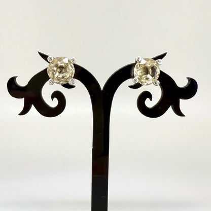 White gold plated silver stud earrings with 8.3 ct natural Lemon Quartz; golden-yellow gemstones in refined design.