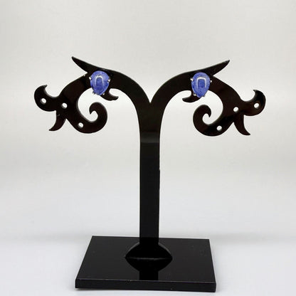 Sterling silver stud earrings with deep blue natural sapphires, plated in white gold for refined brilliance.
