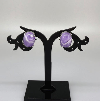 Natural amethyst stud earrings in white gold plated sterling silver with butterfly backs.