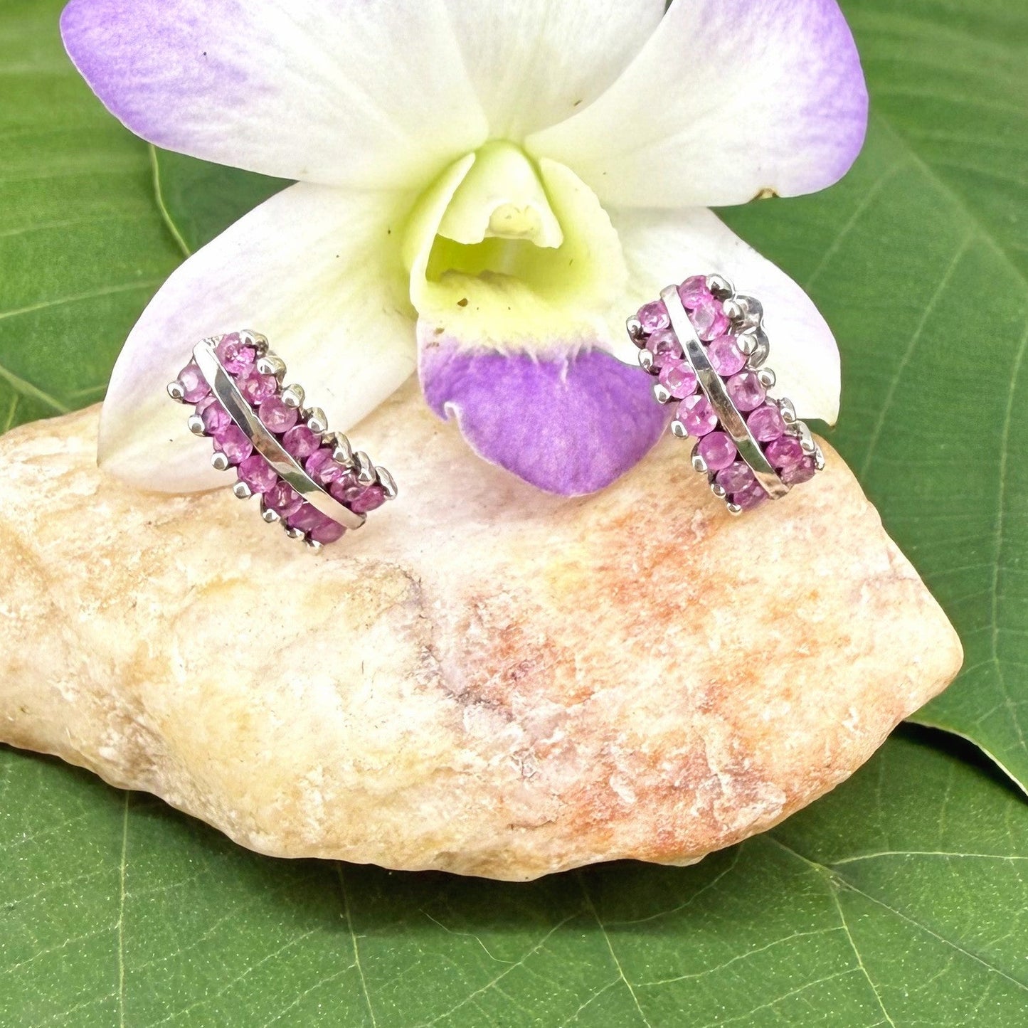 White gold plated silver hoop earrings with natural amethysts in vivid lilac tones; elegant and timeless gemstone design.