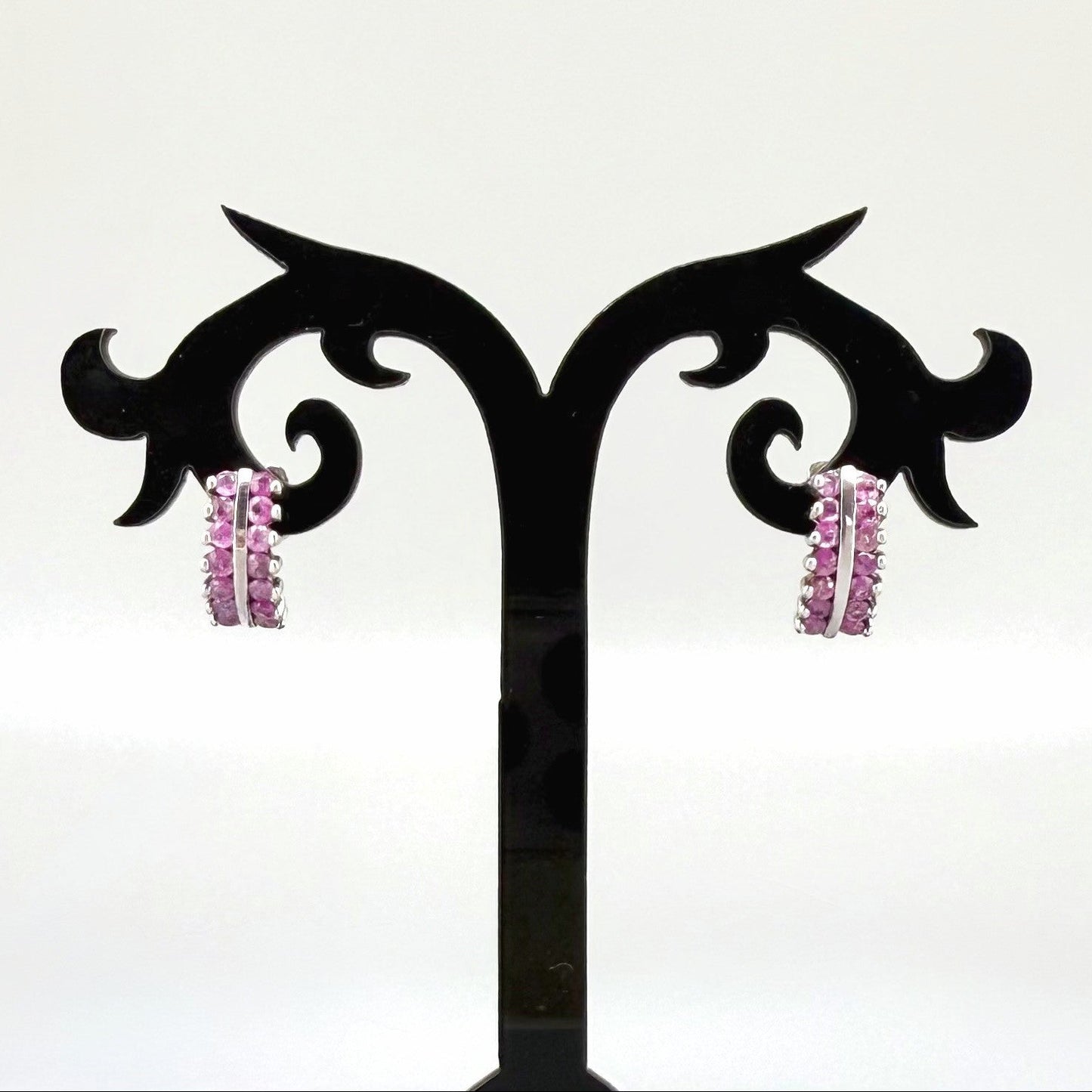 White gold plated silver hoop earrings with natural amethysts in vivid lilac tones; elegant and timeless gemstone design.