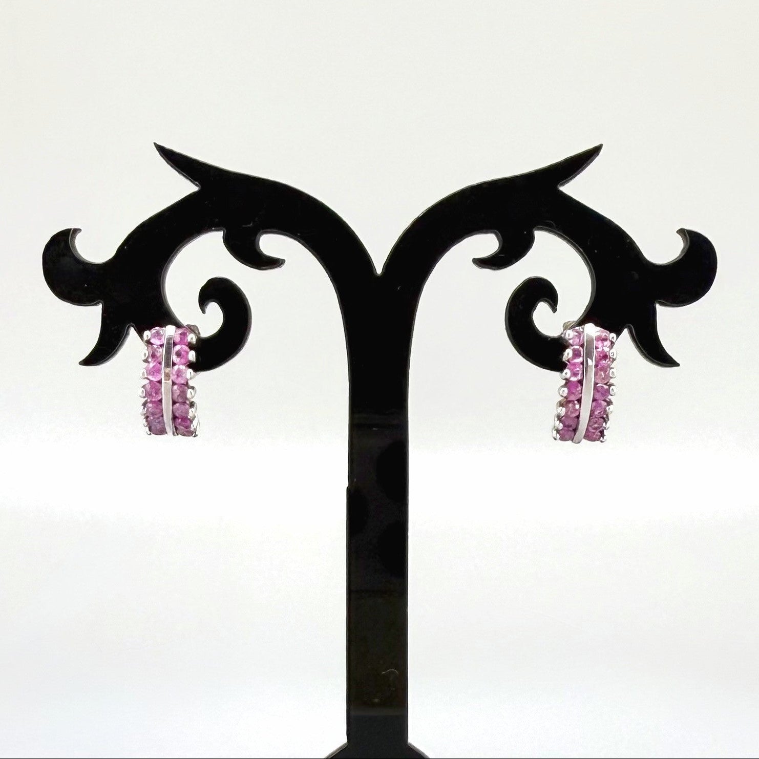 White gold plated silver hoop earrings with natural amethysts in vivid lilac tones; elegant and timeless gemstone design.